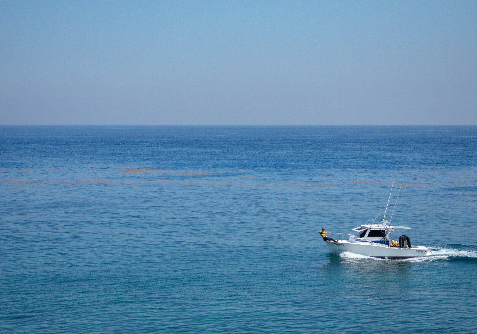 Aerial view of a ship on the sea fishing charter dubai<br />