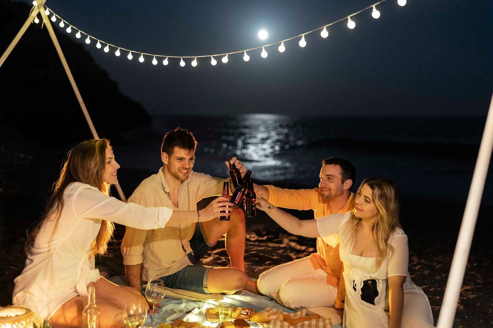 friends-celebrating-toasting-beach-night party boat dubai<br />
